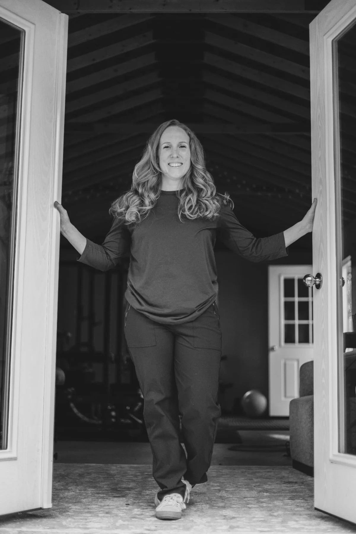 Kathryn Paine welcoming patients through the open doors of Sango Movement Lab